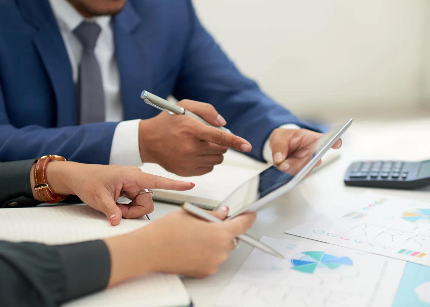 Business professionals reviewing customs documents and shipment costs